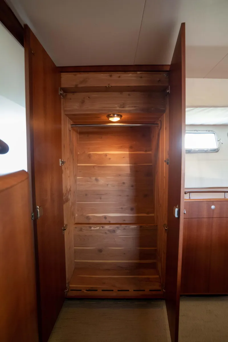 Slide: The Image of Wooden closet interior on a 2008 Huckins Linwood yacht. - 33