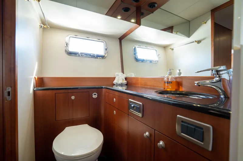 Slide: The Image of Luxurious bathroom in a 2008 Huckins Linwood yacht with wooden cabinetry and modern fixtures. - 34