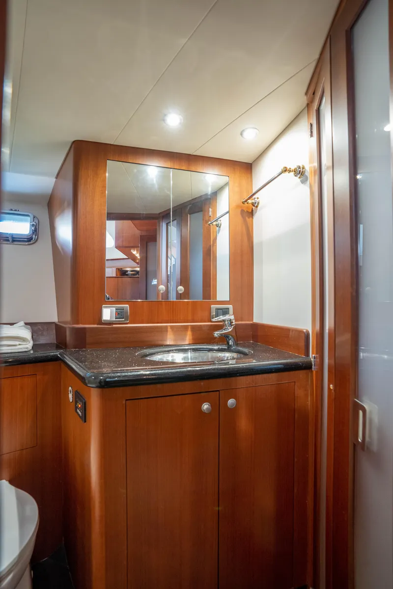 Slide: The Image of 2008 Huckins Linwood yacht bathroom with wooden cabinetry and modern fixtures. - 35