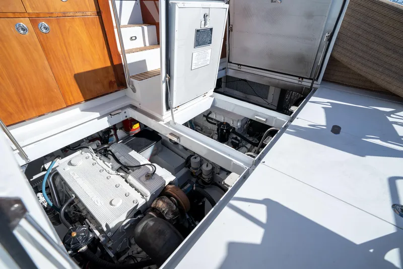 Slide: The Image of Engine compartment of a 2008 Huckins Linwood boat with open hatches. - 40