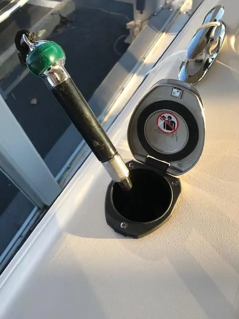 Slide: The Image of 2024 Grady-White Freedom 235 boat fuel cap with key inserted. - 13