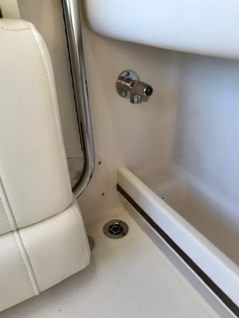 Slide: The Image of 2024 Grady-White Freedom 235 interior detail showing seat and drain. - 14