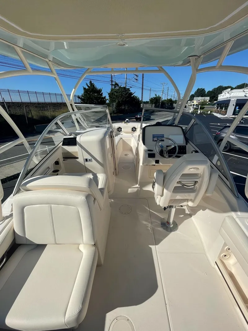 Slide: The Image of 2024 Grady-White Freedom 235 boat interior with seating and helm station. - 4