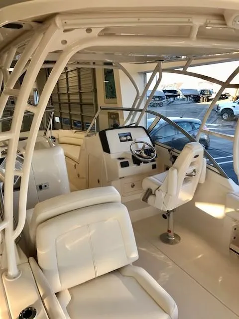 Slide: The Image of 2024 Grady-White Freedom 235 boat interior with helm station and seating. - 5