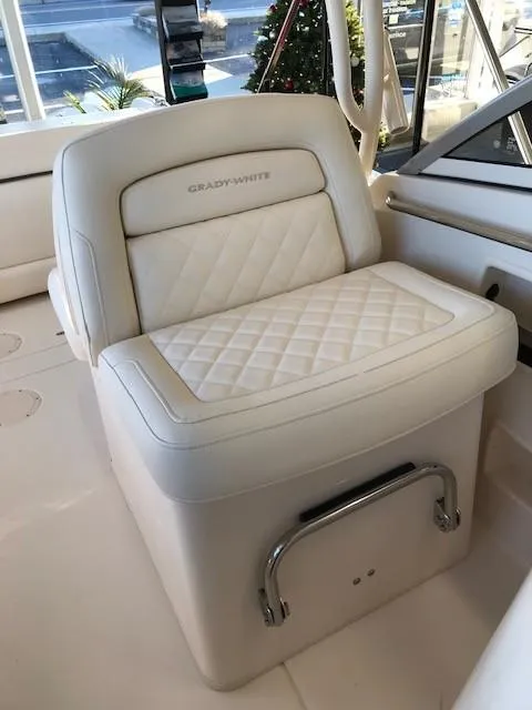 Slide: The Image of 2024 Grady-White Freedom 235 boat seat with white quilted upholstery. - 6