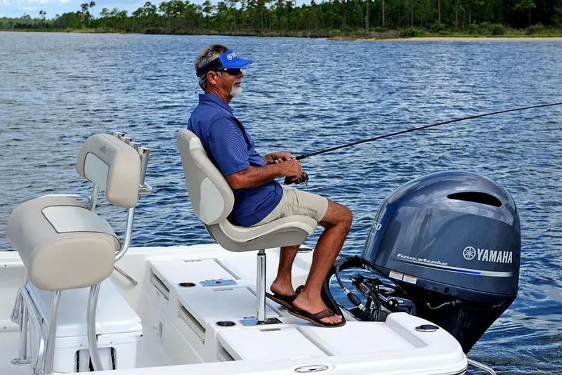 Slide: The Image of Man fishing on a 2023 NauticStar 215 Bay boat with Yamaha outboard motor. - 20
