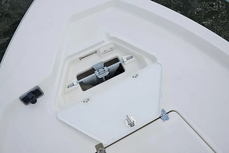 Slide: The Image of 2023 NauticStar 215 Bay boat anchor storage compartment. - 8