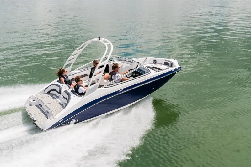 Slide: The Image of 2023 Yamaha Outboards 195S boat cruising on water with passengers. - 1
