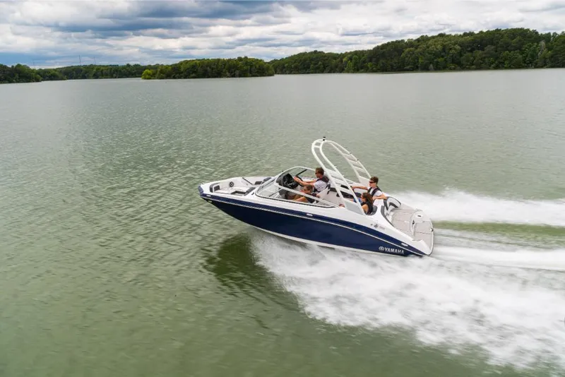 Slide: The Image of 2023 Yamaha Outboards 195S speedboat cruising on a lake. - 11