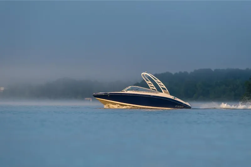 Slide: The Image of 2023 Yamaha Outboards 195S boat cruising on a calm lake. - 15