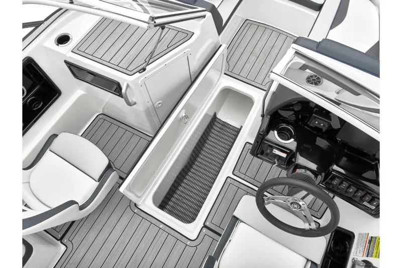 Slide: The Image of 2023 Yamaha Outboards 195S boat interior with storage compartment and steering console. - 17