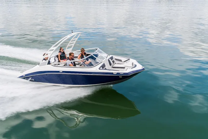 Slide: The Image of 2023 Yamaha Outboards 195S speedboat cruising on a calm lake with passengers. - 3