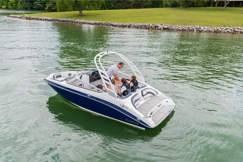 Slide: The Image of 2023 Yamaha Outboards 195S boat cruising on a lake with passengers. - 5