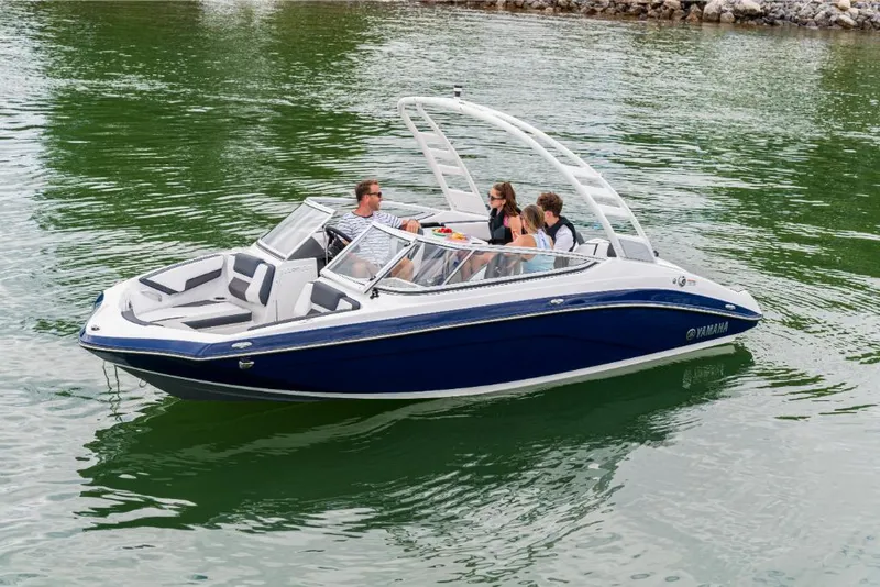 Slide: The Image of 2023 Yamaha Outboards 195S boat cruising on a lake with passengers. - 6