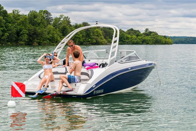 Slide: The Image of 2023 Yamaha Outboards 195S boat with people enjoying water activities. - 8
