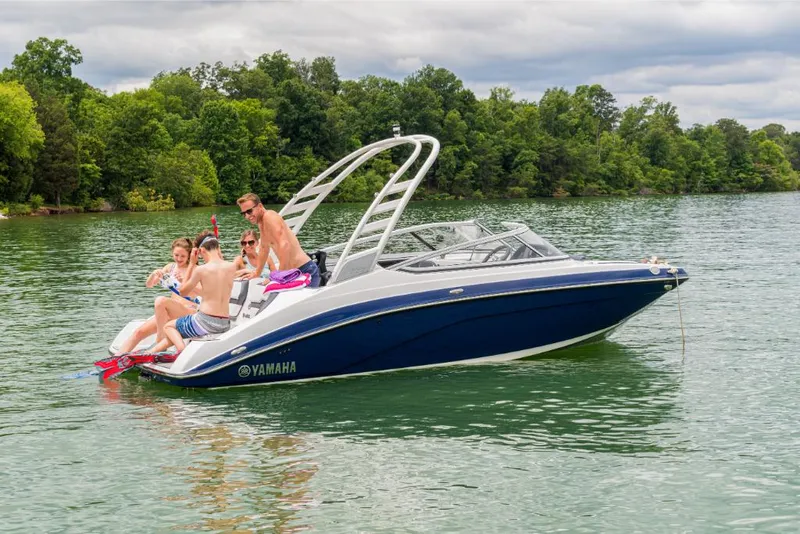 Slide: The Image of 2023 Yamaha Outboards 195S boat with people enjoying water activities. - 9