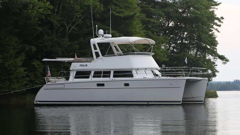 Slide: The Image of 2007 PDQ MV-41 yacht anchored on calm water. - 0