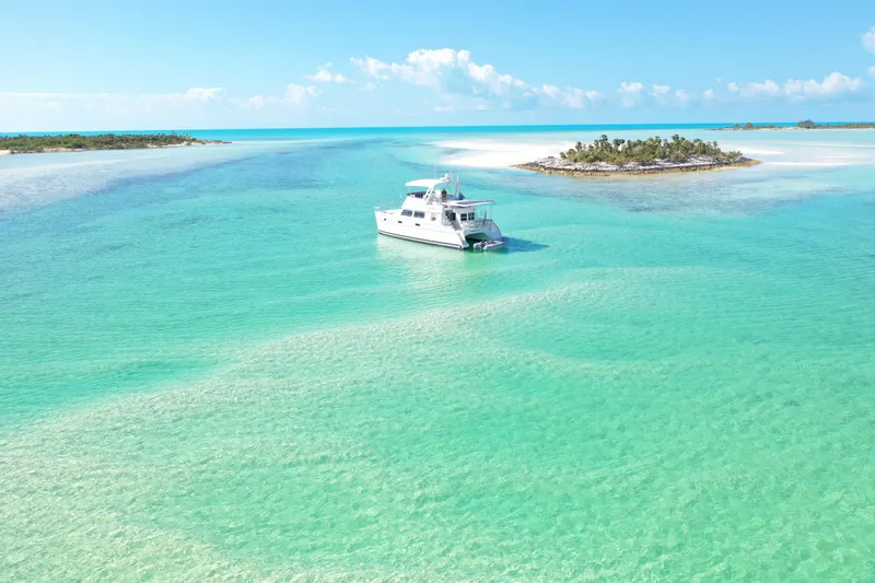 Slide: The Image of PDQ MV-41 yacht in turquoise waters near an island, 2007. - 1