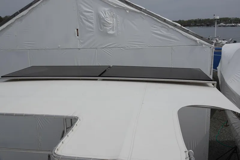 Slide: The Image of Solar panels mounted on a 2007 PDQ MV-41 boat roof. - 21