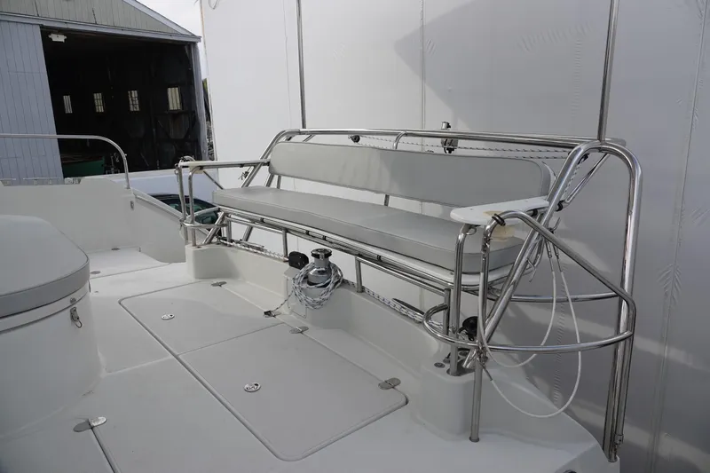 Slide: The Image of PDQ MV-41 boat, 2007, featuring bench seating and stainless steel railing. - 23