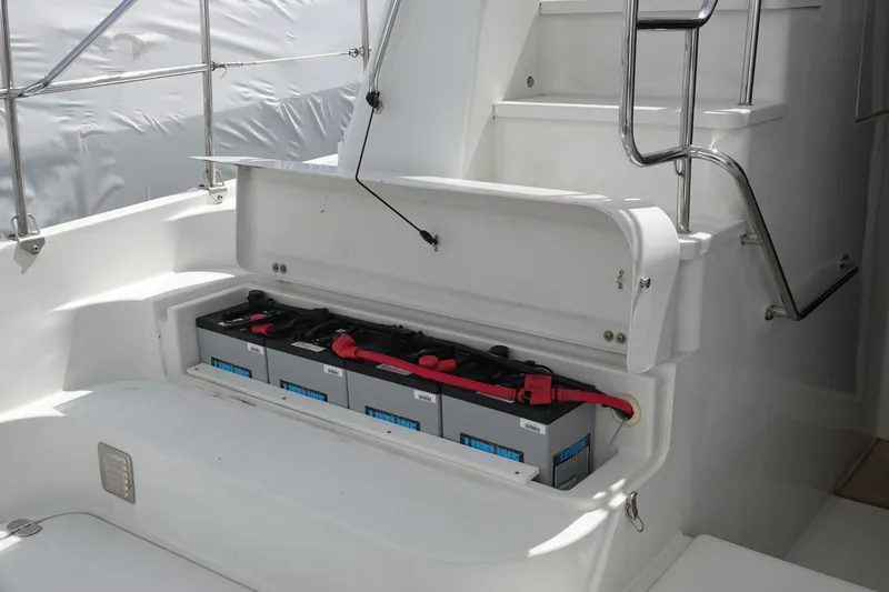 Slide: The Image of Battery compartment of a 2007 PDQ MV-41 boat with four batteries. - 26