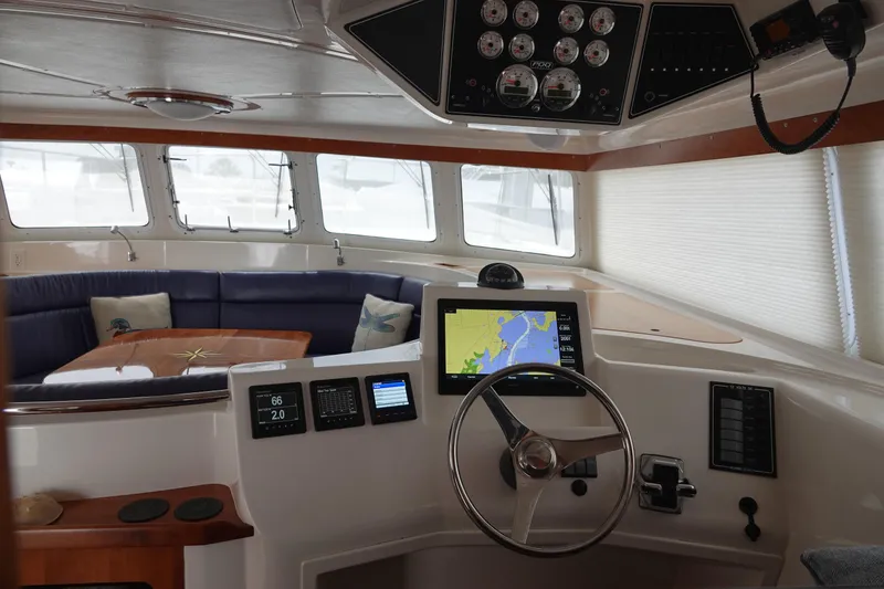 Slide: The Image of Interior of a 2007 PDQ MV-41 yacht with helm console. - 5