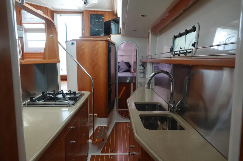 Slide: The Image of Interior of a 2007 PDQ MV-41 yacht featuring a modern kitchen. - 7