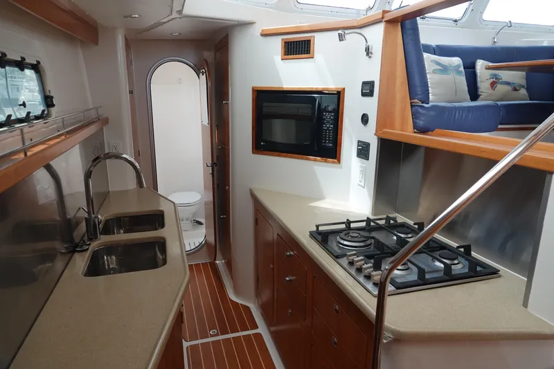 Slide: The Image of Interior of a 2007 PDQ MV-41 yacht with kitchen and bathroom. - 9