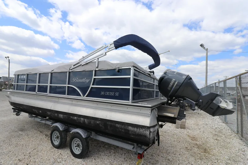Slide: The Image of 2019 Bentley Pontoons 240/243 Cruise on trailer, featuring Yamaha outboard motor. - 2