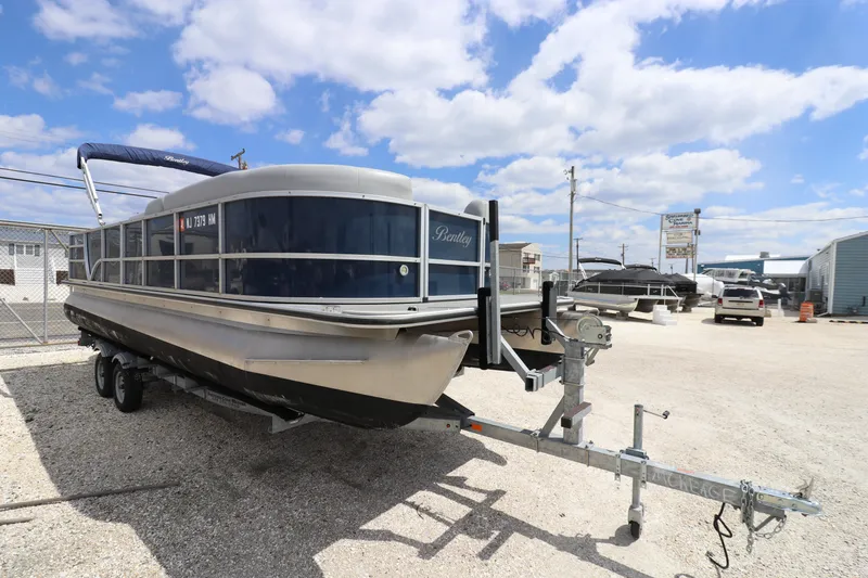 Slide: The Image of 2019 Bentley Pontoons 240/243 Cruise boat on trailer in sunny outdoor setting. - 3