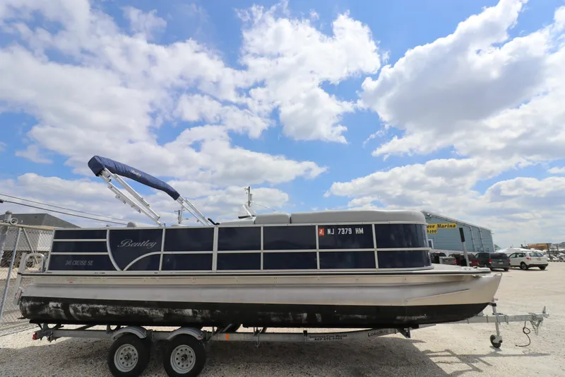 Slide: The Image of 2019 Bentley Pontoons 240/243 Cruise on trailer under a partly cloudy sky. - 4