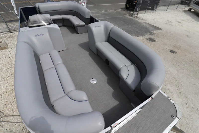 Slide: The Image of 2019 Bentley Pontoons 240/243 Cruise with spacious gray seating and open deck layout. - 5