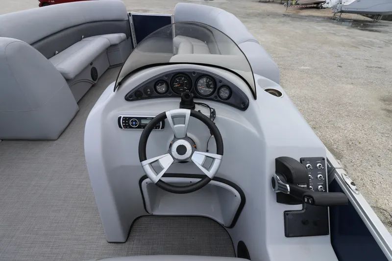 Slide: The Image of 2019 Bentley Pontoons 240/243 Cruise dashboard with steering wheel and controls. - 9
