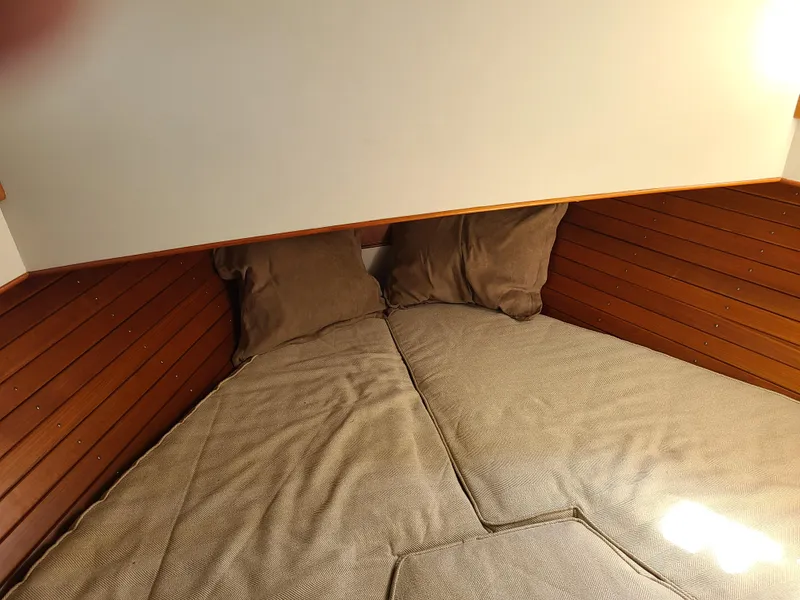 Slide: The Image of Cozy sleeping quarters in a 1989 Grand Banks 42 Classic yacht. - 10