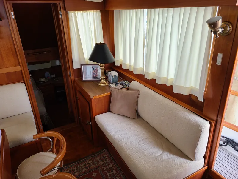 Slide: The Image of Interior of 1989 Grand Banks 42 Classic yacht with sofa, lamp, and wooden furnishings. - 5
