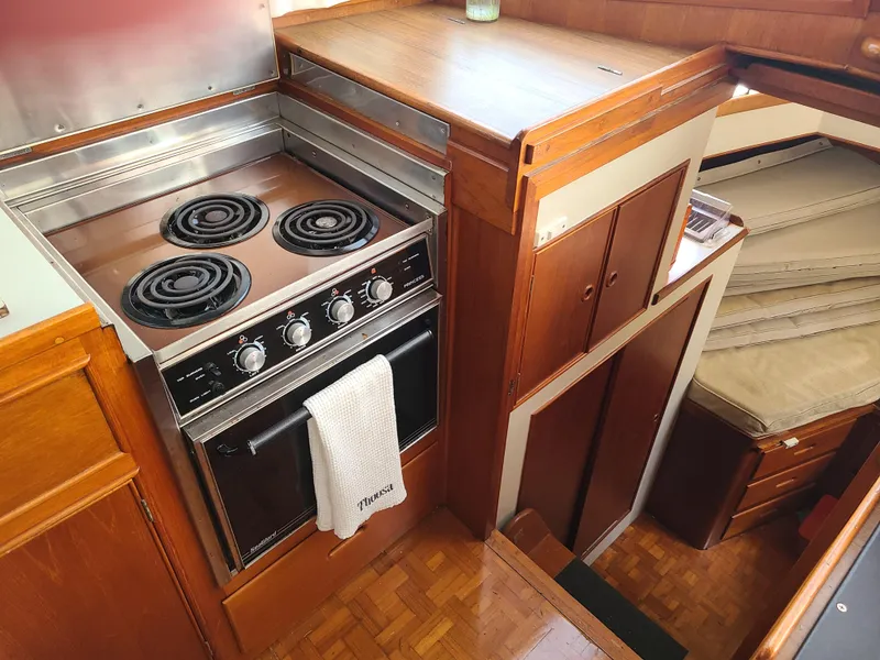 Slide: The Image of 1989 Grand Banks 42 Classic galley with electric stove and oven. - 7