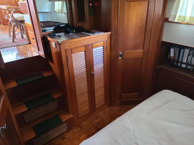 Slide: The Image of Interior of 1989 Grand Banks 42 Classic yacht with wooden cabinetry and stairs. - 9