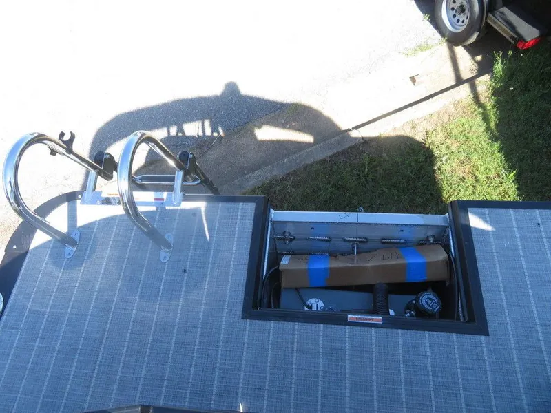 Slide: The Image of 2021 Coach Pontoons 245 RFC-21 rear deck with storage compartment and ladder. - 10