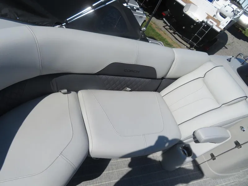 Slide: The Image of 2021 Coach Pontoons 245 RFC-21, luxurious seating area with cup holder. - 13