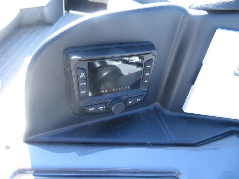 Slide: The Image of 2021 Coach Pontoons 245 RFC-21 dashboard with Wet Sounds audio system. - 3