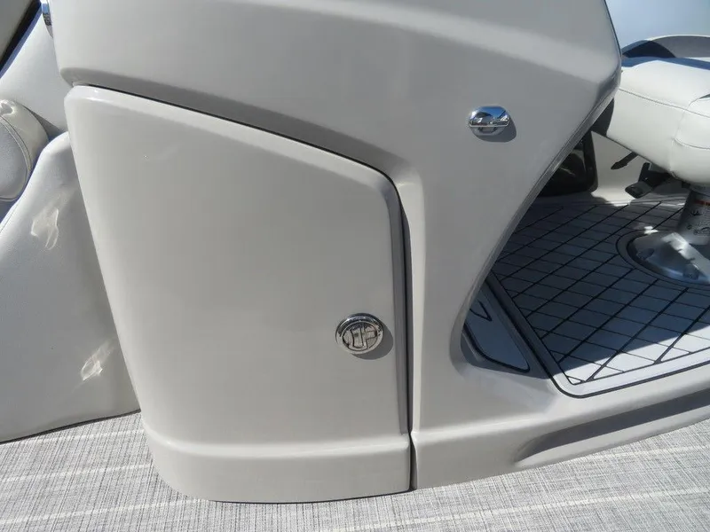 Slide: The Image of 2021 Coach Pontoons 245 RFC-21 interior detail, showing storage compartment and seating area. - 4