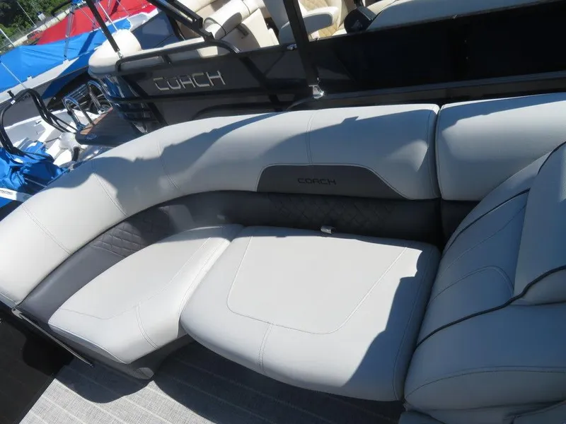 Slide: The Image of 2021 Coach Pontoons 245 RFC-21, luxurious seating area with gray upholstery. - 5