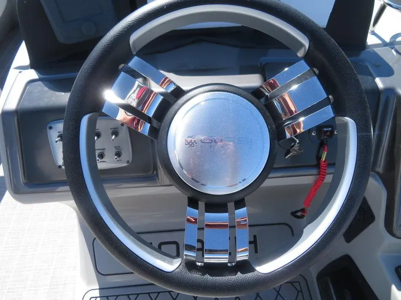 Slide: The Image of Steering wheel of a 2021 Coach Pontoons 245 RFC-21 boat. - 6