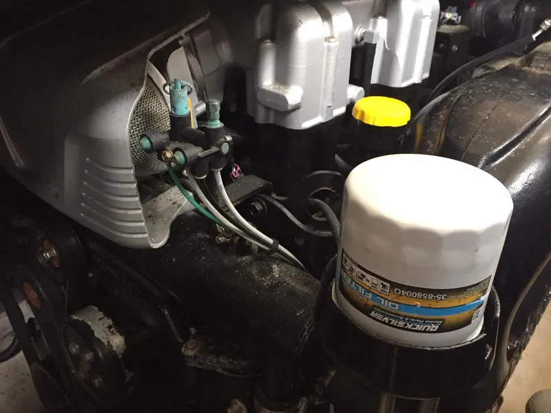 Slide: The Image of Engine components of a 2013 Meridian 341 Sedan, featuring a visible oil filter. - 17