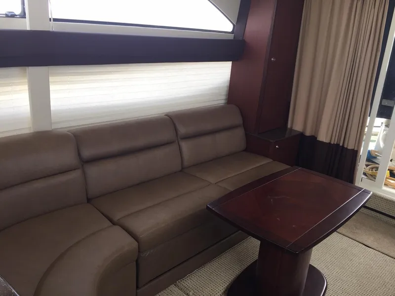Slide: The Image of Luxurious interior of 2013 Meridian 341 Sedan with leather sofa and wooden table. - 18