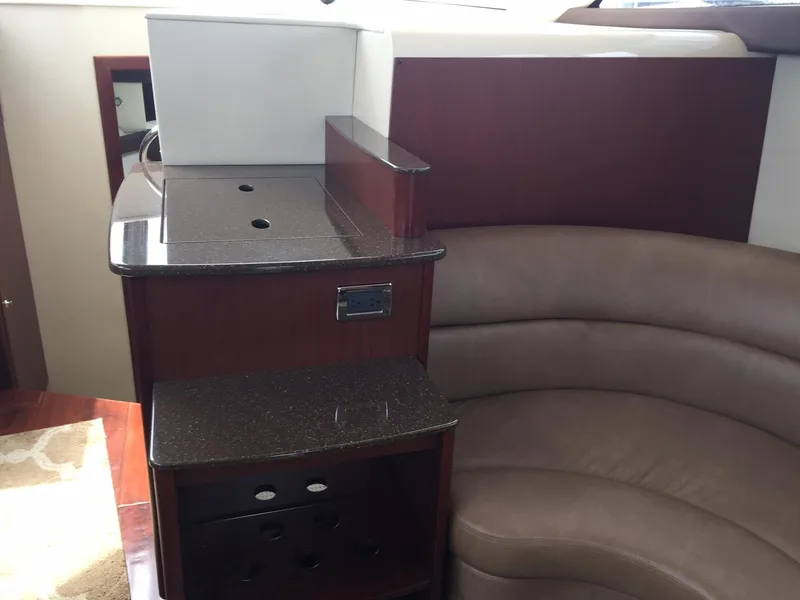 Slide: The Image of Interior of 2013 Meridian 341 Sedan with curved seating and dark wood accents. - 21