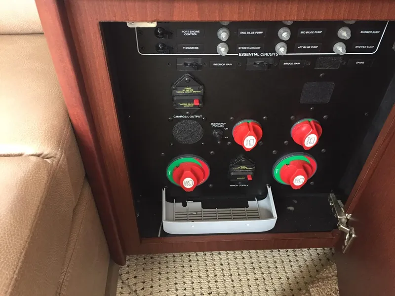 Slide: The Image of Electrical panel inside a 2013 Meridian 341 Sedan boat, featuring circuit controls and switches. - 28