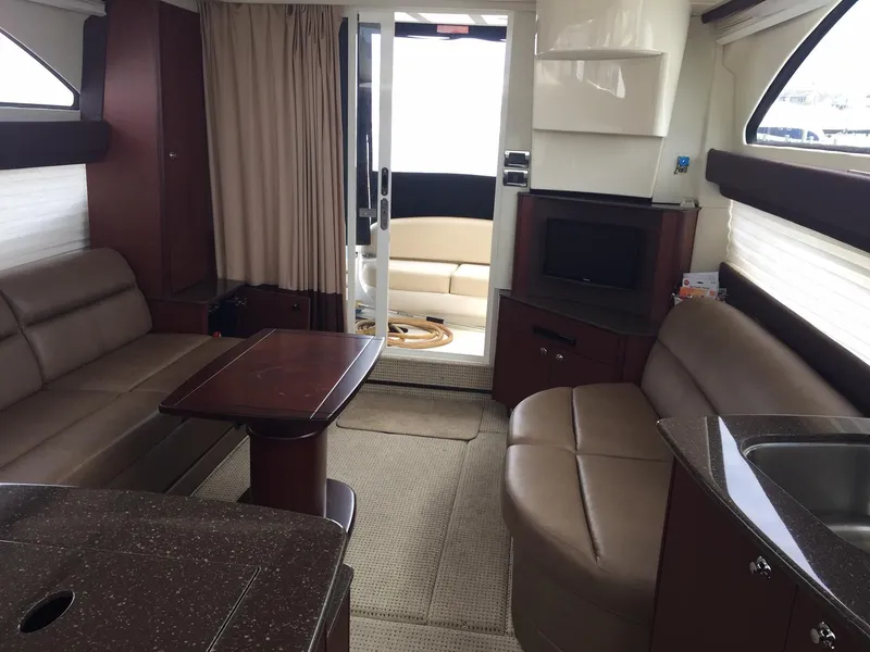 Slide: The Image of Interior of 2013 Meridian 341 Sedan yacht with modern seating and entertainment area. - 29