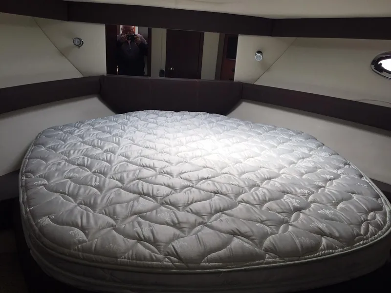 Slide: The Image of Interior cabin of 2013 Meridian 341 Sedan with a large, comfortable bed. - 31