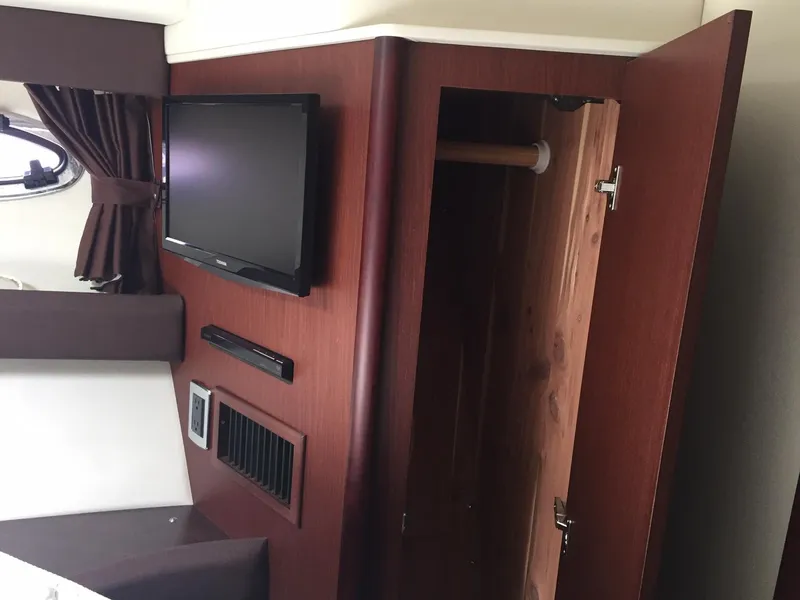 Slide: The Image of Interior of 2013 Meridian 341 Sedan with TV and open wooden cabinet. - 32